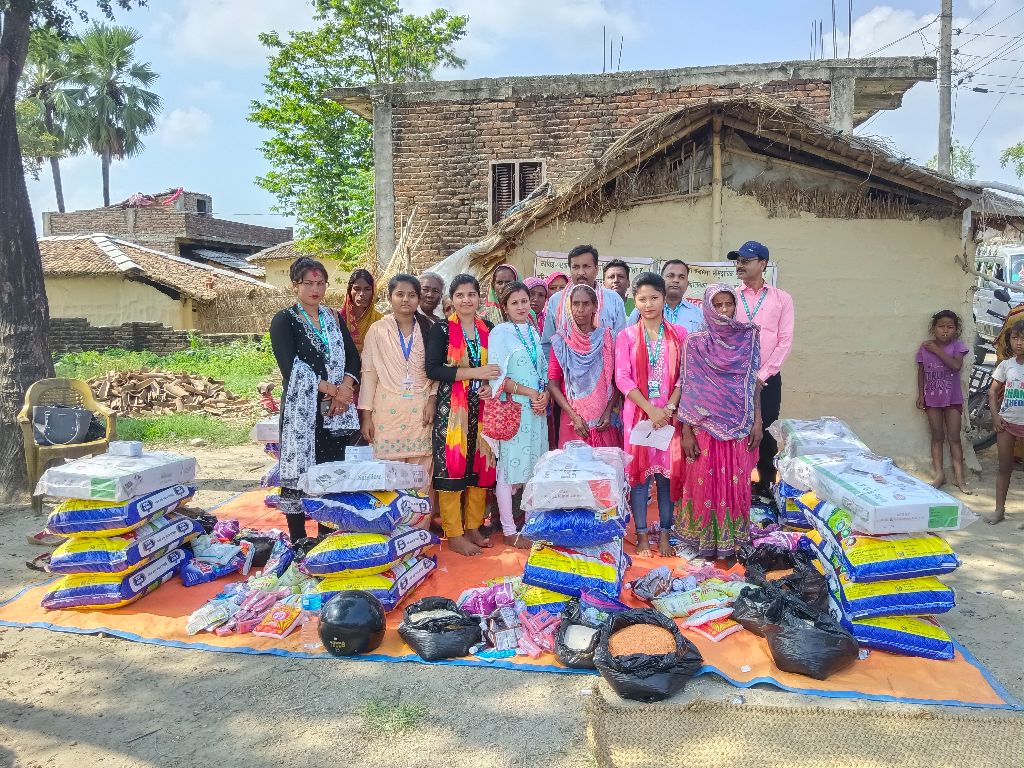 Flood relief distribution with GUA staff and community