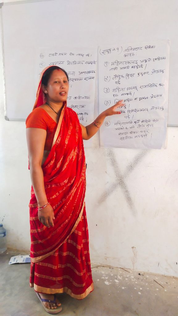 Woman leader presenting at whiteboard
